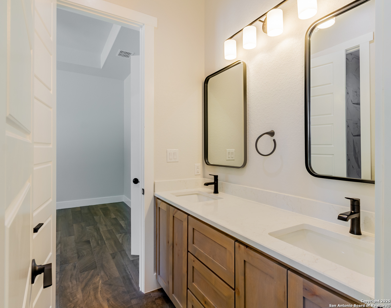 246 Timber Place La Vernia, TX 78121 - Photo 22 of 33 a bathroom with a sink and a mirror
