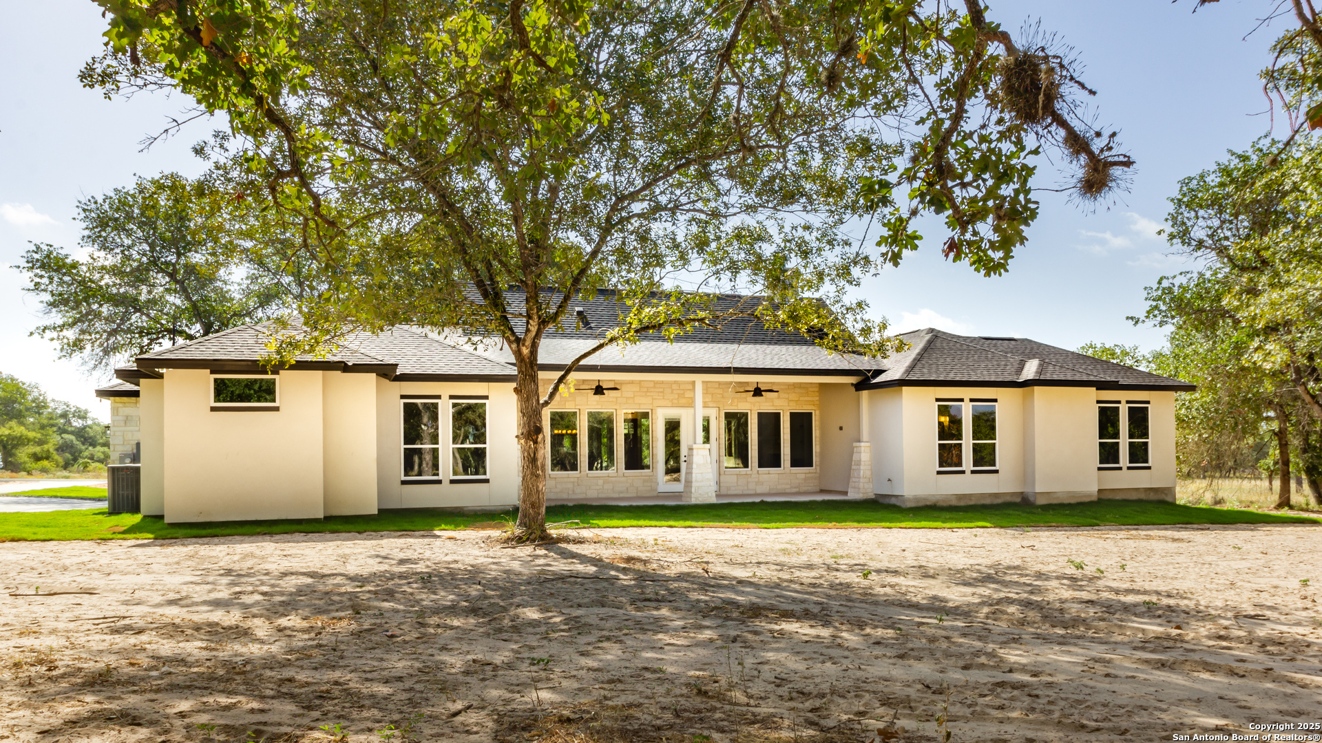 246 Timber Place La Vernia, TX 78121 - Photo 29 of 33 a front view of a house with a garden
