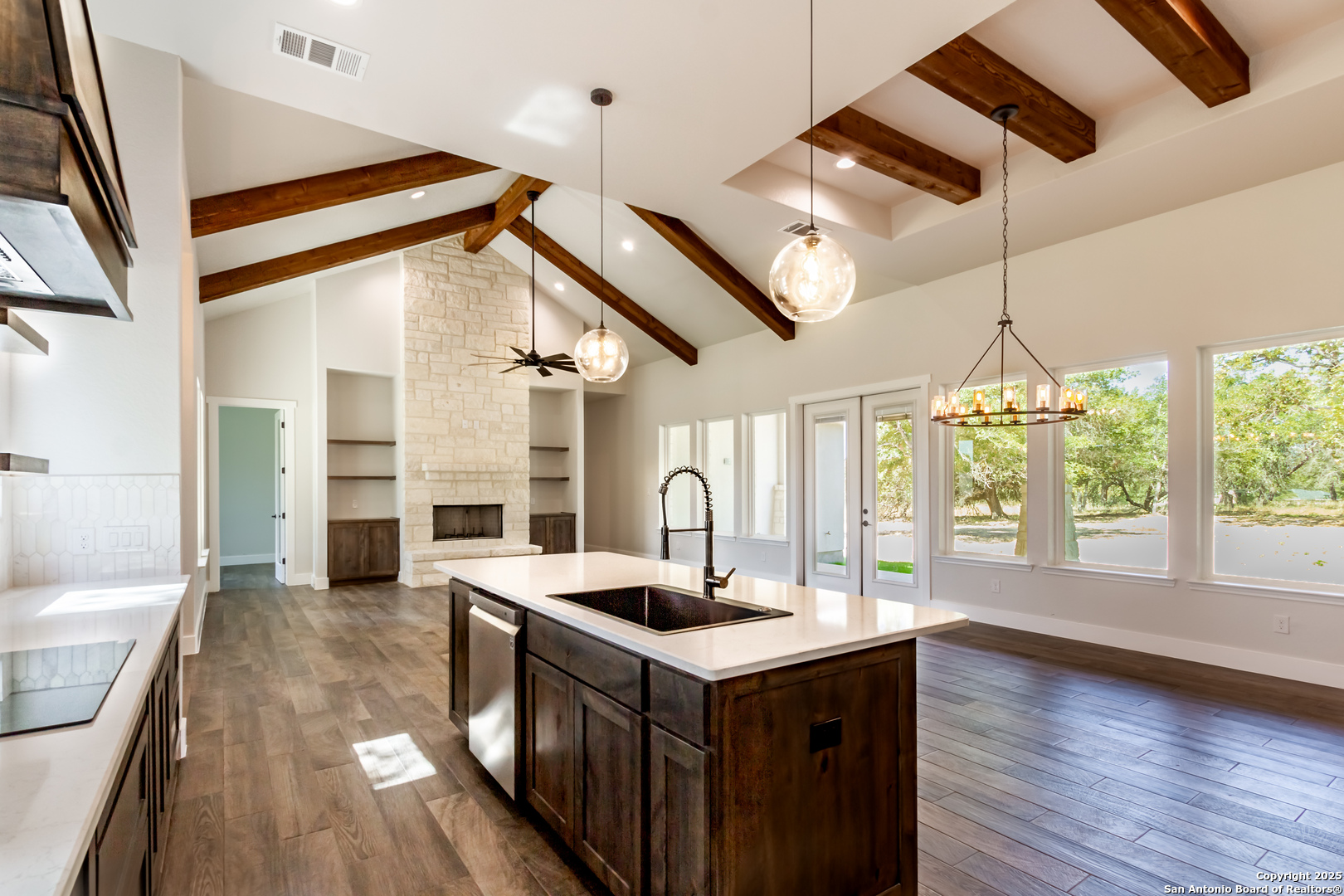 246 Timber Place La Vernia, TX 78121 - Photo 5 of 33 a kitchen with a sink and wooden floor