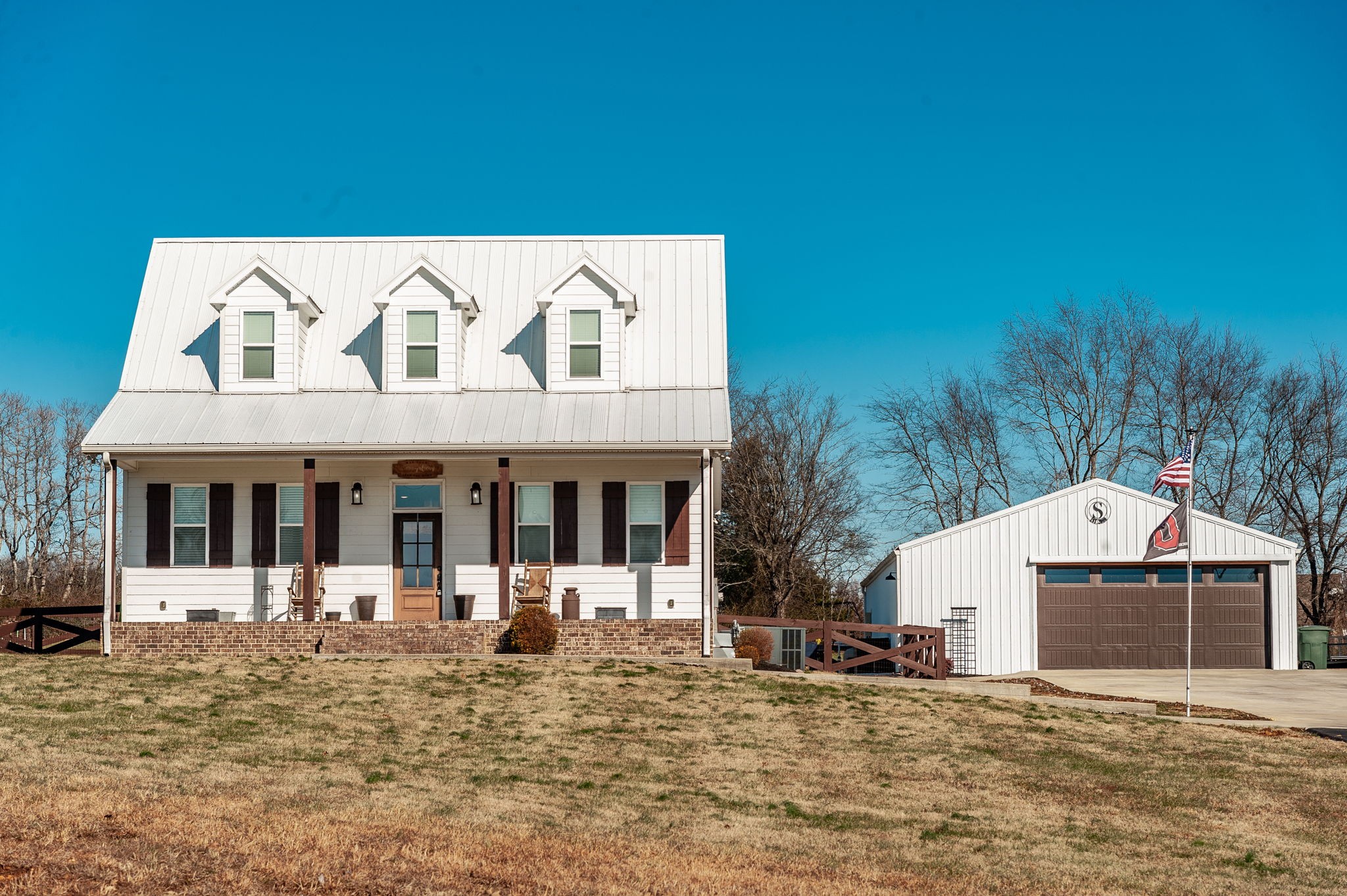 449 Fowler Ford Road Portland, TN 37148 - Photo 1 of 46 a view of a house with floor to ceiling windows and a basket ball poll