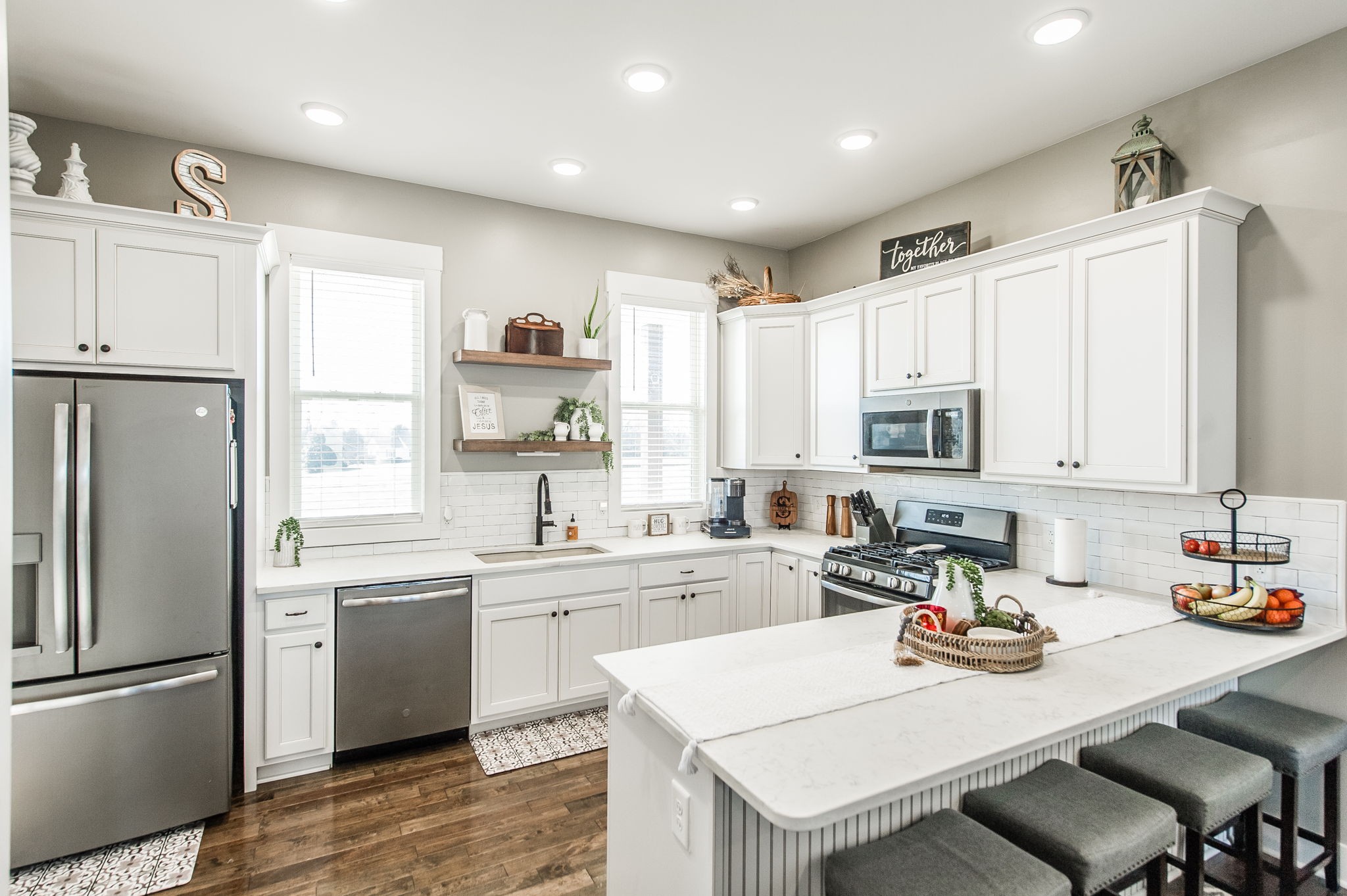 449 Fowler Ford Road Portland, TN 37148 - Photo 22 of 46 a kitchen with a sink a stove a refrigerator and white cabinets