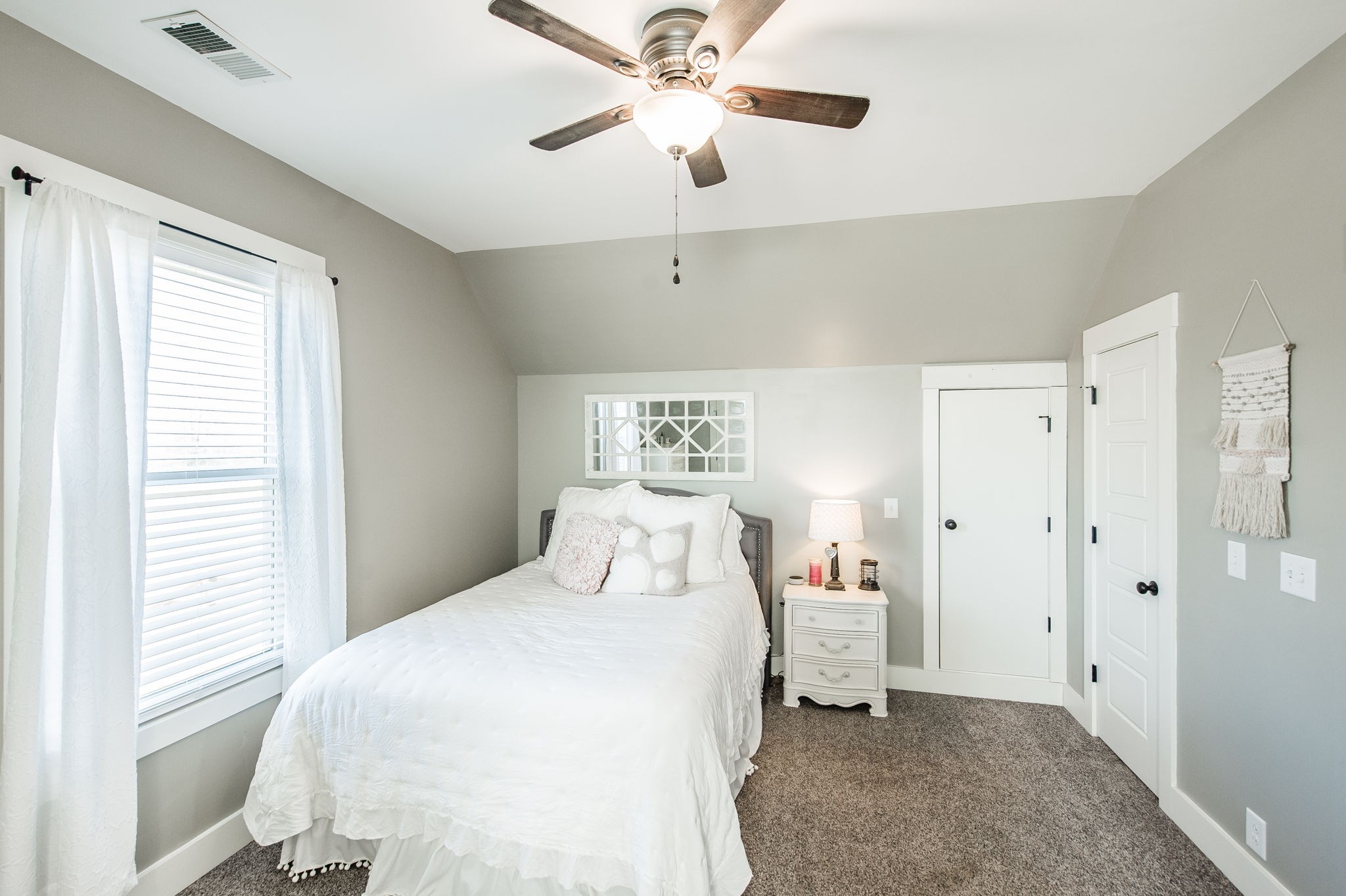 449 Fowler Ford Road Portland, TN 37148 - Photo 33 of 46 a bedroom with a bed and a chandelier