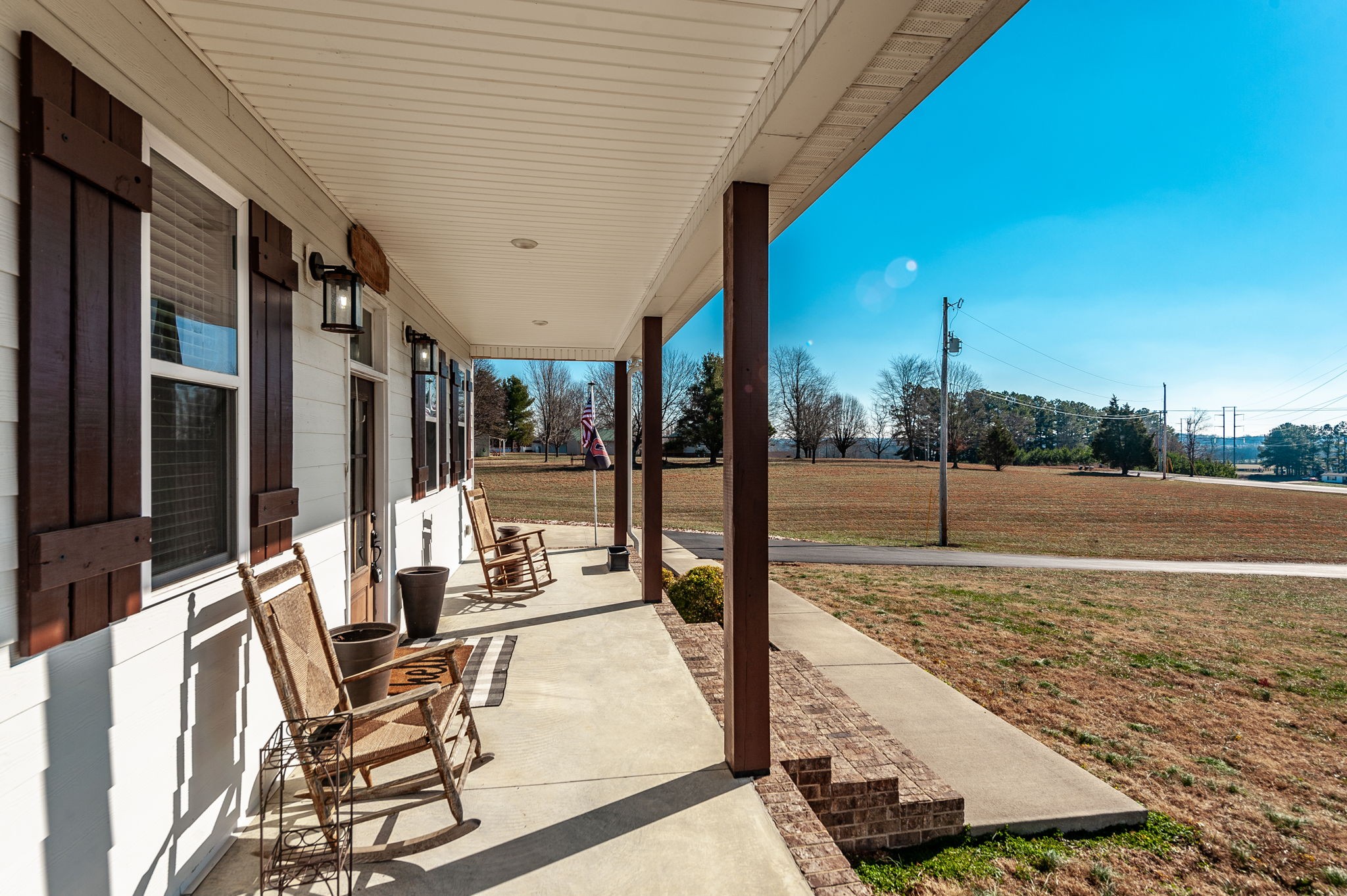 449 Fowler Ford Road Portland, TN 37148 - Photo 9 of 46 a view of a patio with table and chairs with wooden floor and fence