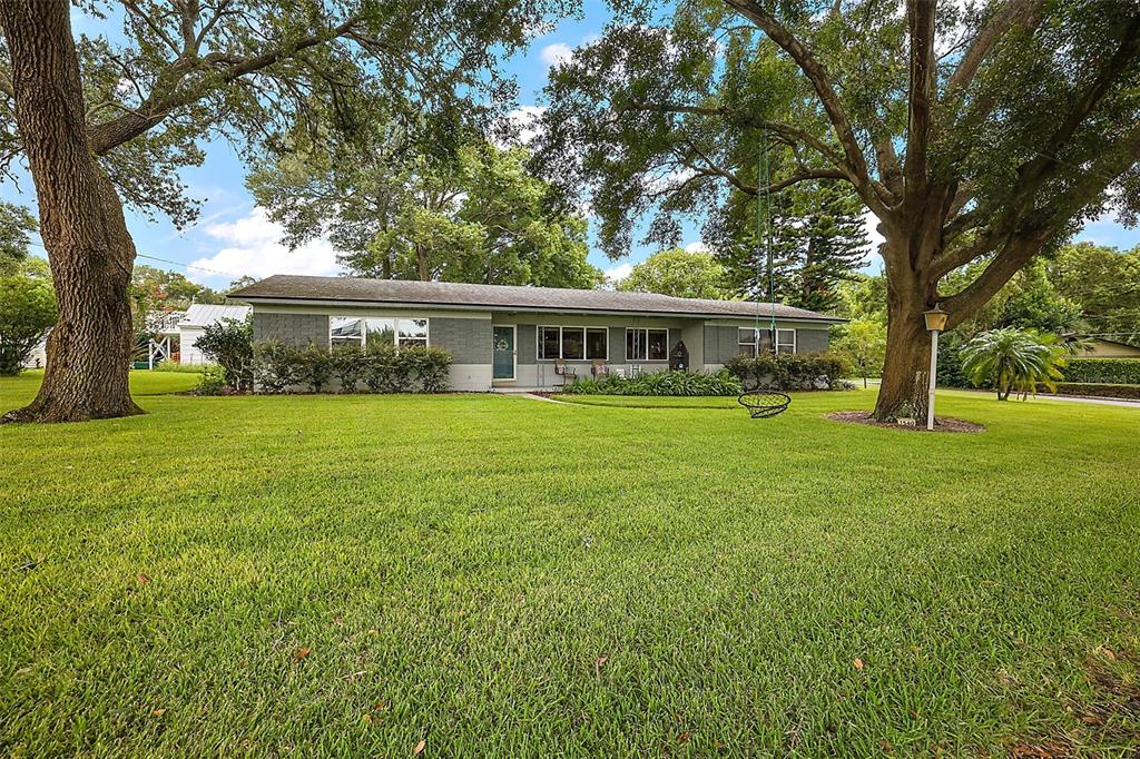 a view of a house with a big yard