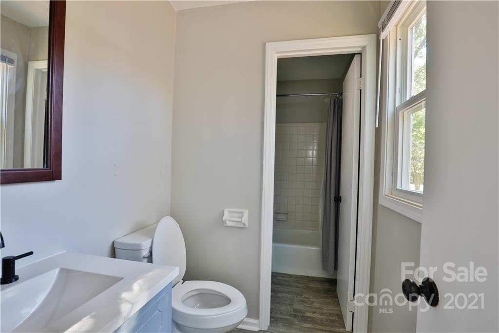7825 Davis Road Mint Hill, NC 28227 - Photo 11 of 16 a white toilet sitting next to a bathroom sink