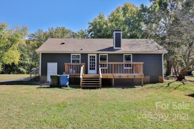 7825 Davis Road Mint Hill, NC 28227 - Photo 14 of 16 a front view of a house with a garden and porch
