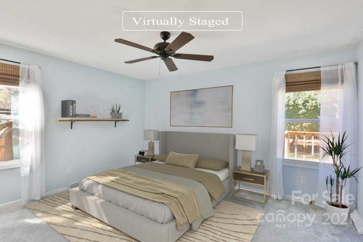 7825 Davis Road Mint Hill, NC 28227 - Photo 7 of 16 a bedroom with a large bed and a window