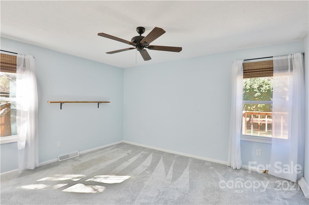 7825 Davis Road Mint Hill, NC 28227 - Photo 8 of 16 a view of empty room with wooden floor and window