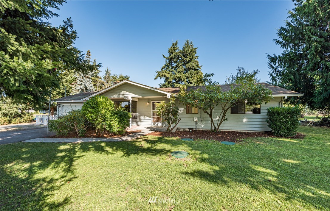 281 Wright Road Sequim, WA 98382 - Photo 1 of 25 a front view of a house with a yard
