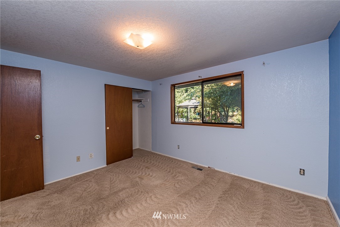 281 Wright Road Sequim, WA 98382 - Photo 12 of 25 a view of an empty room with a window