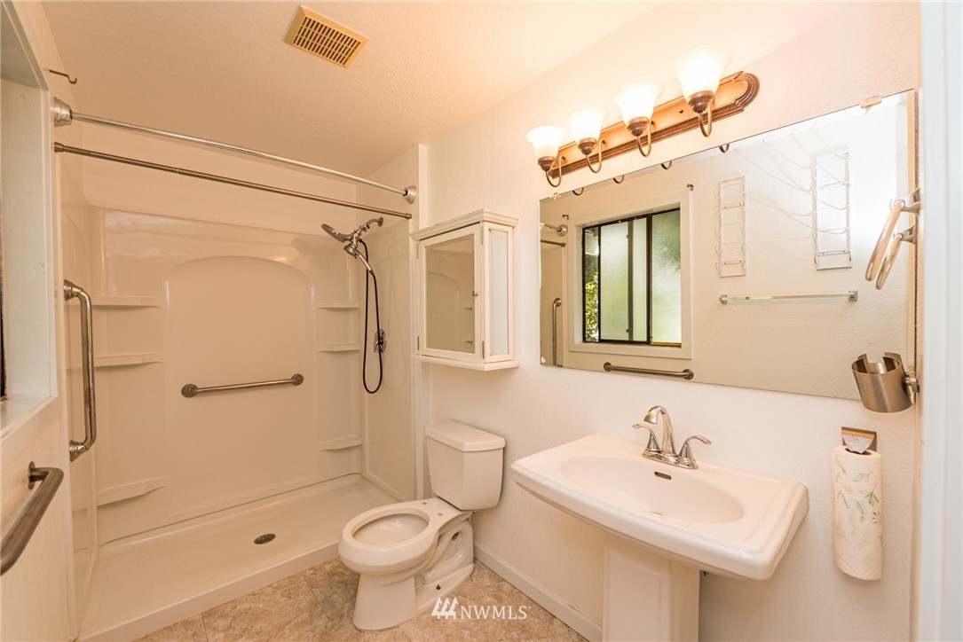 281 Wright Road Sequim, WA 98382 - Photo 13 of 25 a bathroom with a sink toilet and shower