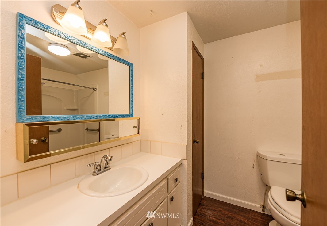 281 Wright Road Sequim, WA 98382 - Photo 14 of 25 a bathroom with a sink vanity granite and toilet