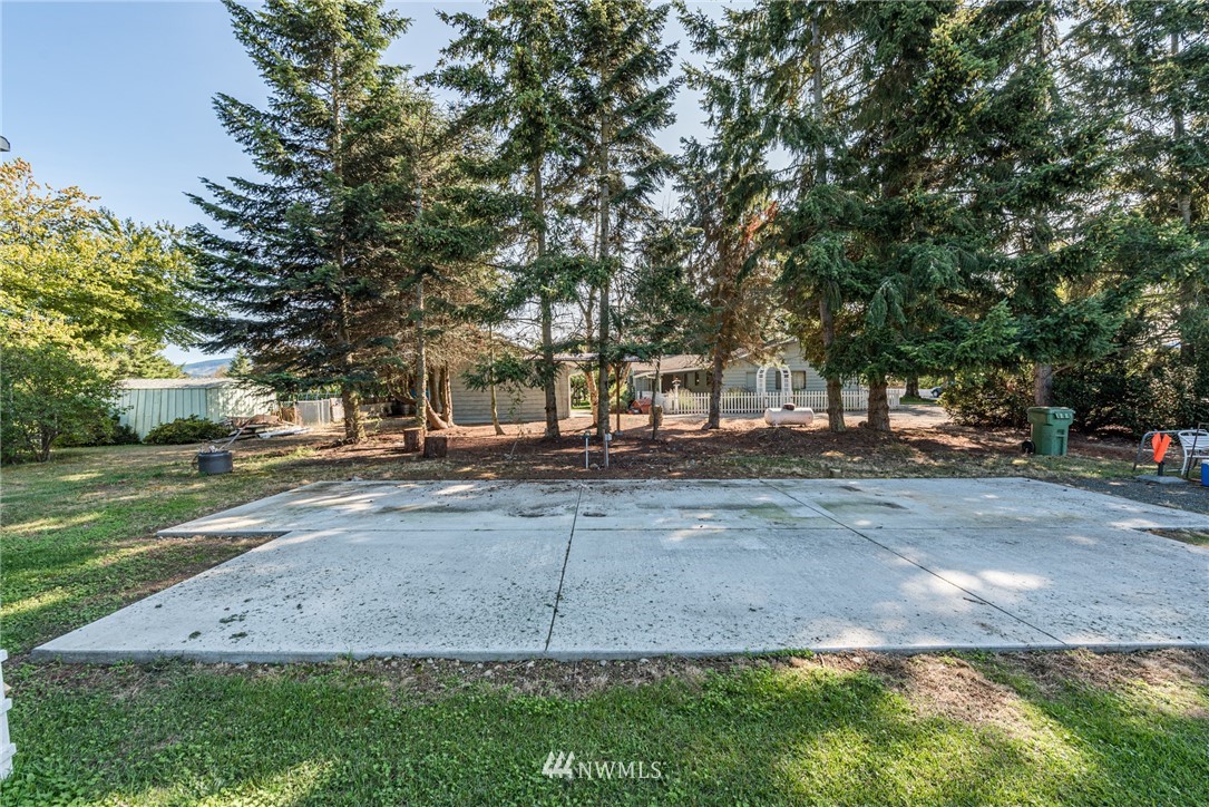 281 Wright Road Sequim, WA 98382 - Photo 17 of 25 a view of a yard with plants and trees