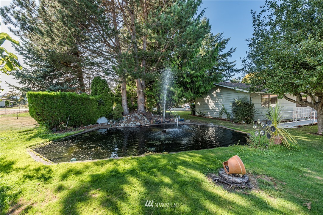 281 Wright Road Sequim, WA 98382 - Photo 18 of 25 a backyard of a house with a yard and outdoor seating