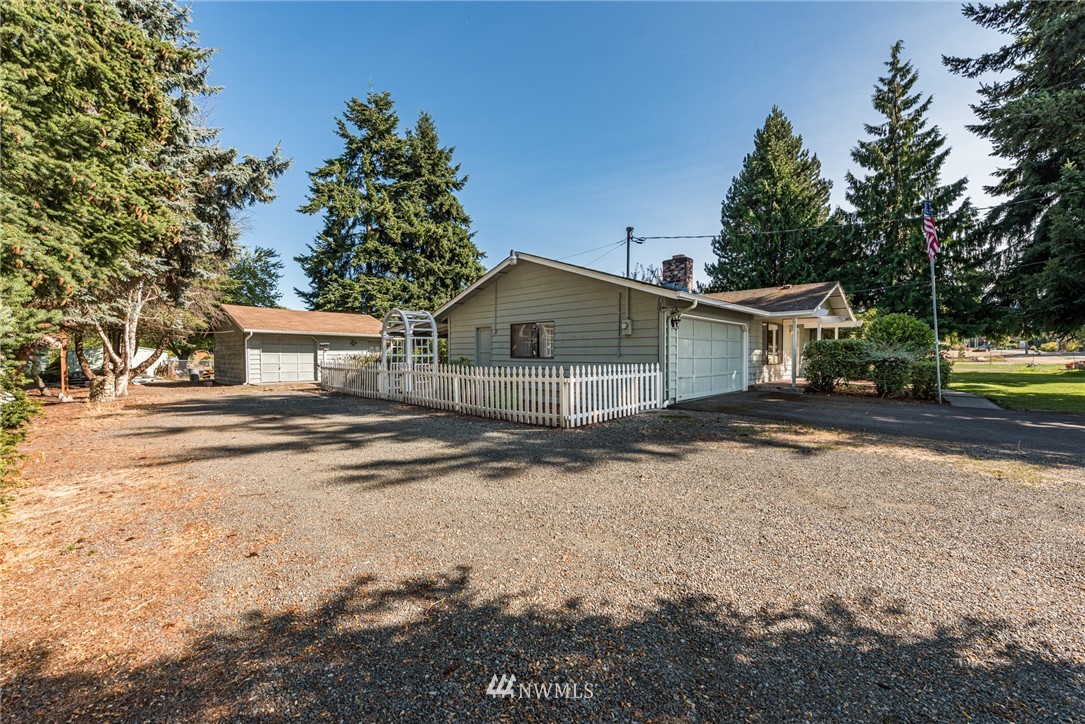 281 Wright Road Sequim, WA 98382 - Photo 24 of 25 a view of a house with backyard and trees
