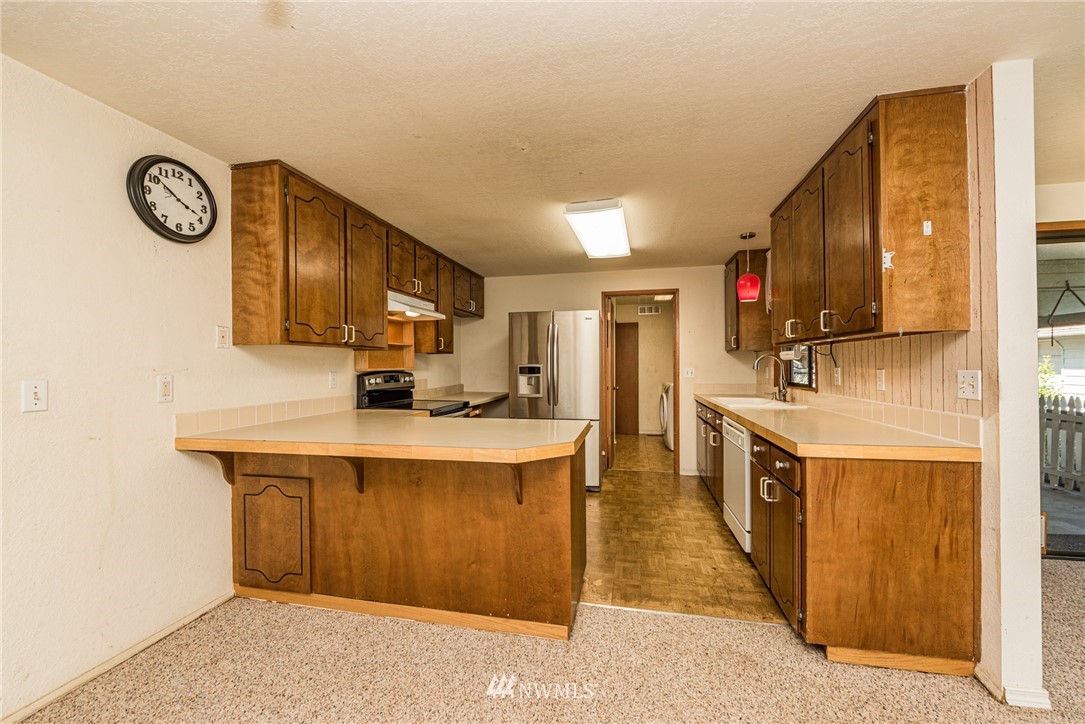 281 Wright Road Sequim, WA 98382 - Photo 5 of 25 a kitchen with a sink cabinets and window