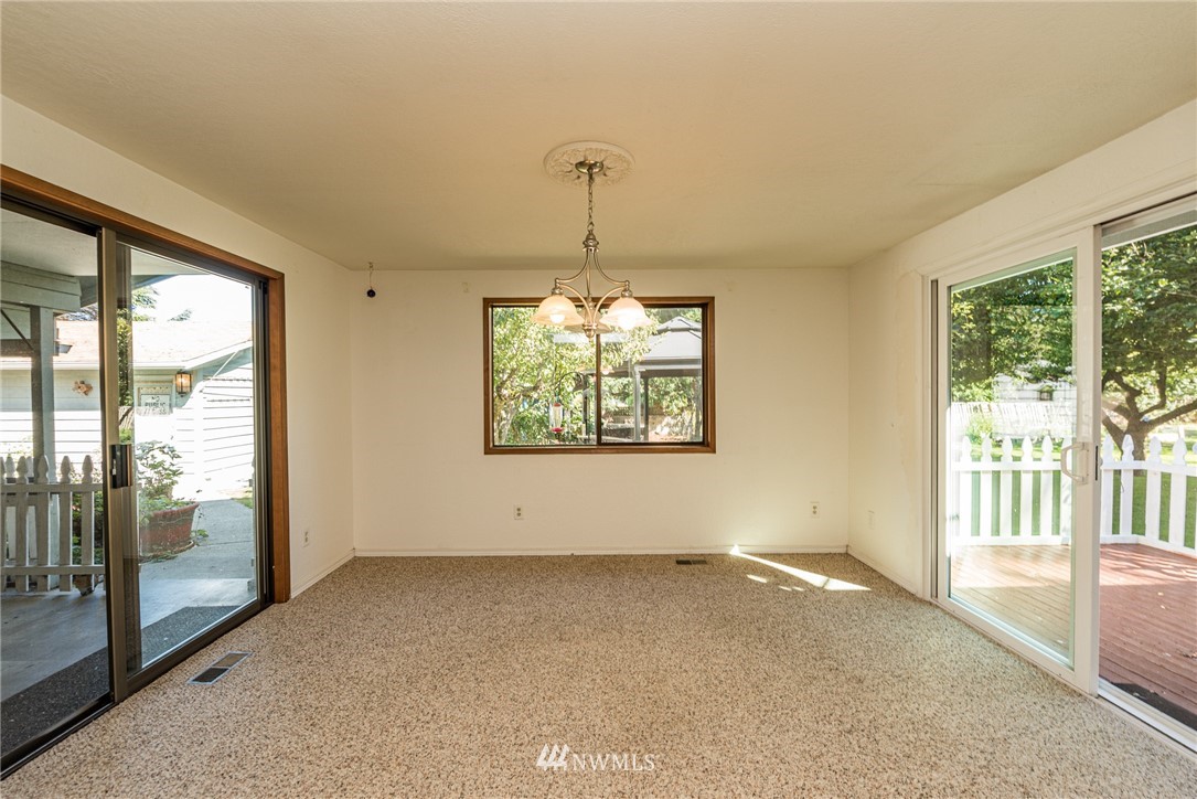281 Wright Road Sequim, WA 98382 - Photo 8 of 25 a view of empty room with floor to ceiling windows