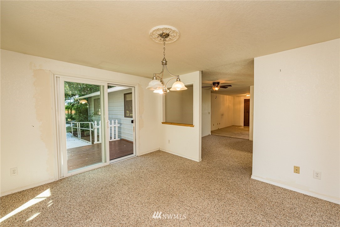 281 Wright Road Sequim, WA 98382 - Photo 9 of 25 a view of a livingroom with a chandelier fan and windows