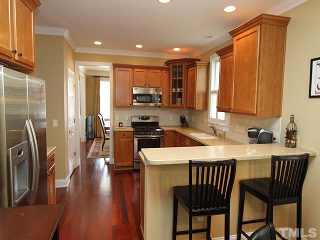 2225 Karns Place Raleigh, NC 27614 - Photo 11 of 23 Watch the chef as they prepare meals in this spacious kitchen with breakfast are and bar. Spread out into the DR if you need ever more space, if you need even more space for entertaining, open the back door to your beautiful screened in porch.