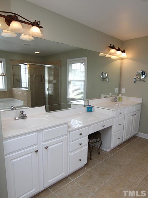2225 Karns Place Raleigh, NC 27614 - Photo 12 of 23 spacious master bath with tile floors, double vanities, and vanity area for those mornings you want to sit down and get ready.