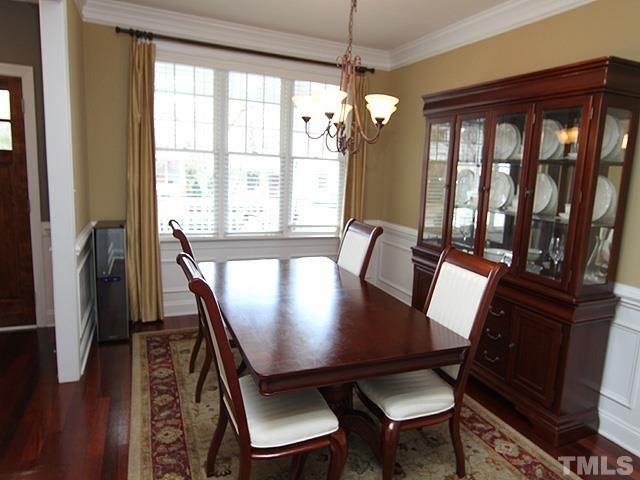 2225 Karns Place Raleigh, NC 27614 - Photo 7 of 23 Formal dining room for those large parties or family gatherings, hardwood floors, beautiful molding, plenty of natural light from the windows, neutral paint, and beautiful moldings.