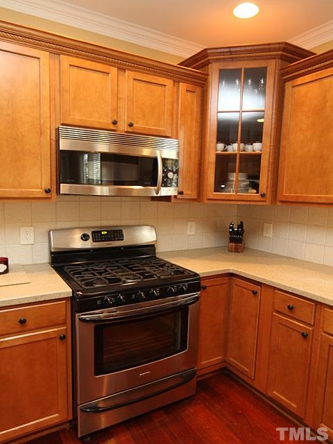 2225 Karns Place Raleigh, NC 27614 - Photo 9 of 23 This kitchen is open and spacious, opens to the breakfast room, overlooks your screened in porch, ss appliances, gorgeous counters, and a bar for even more room. Lots of seating in this kitchen.