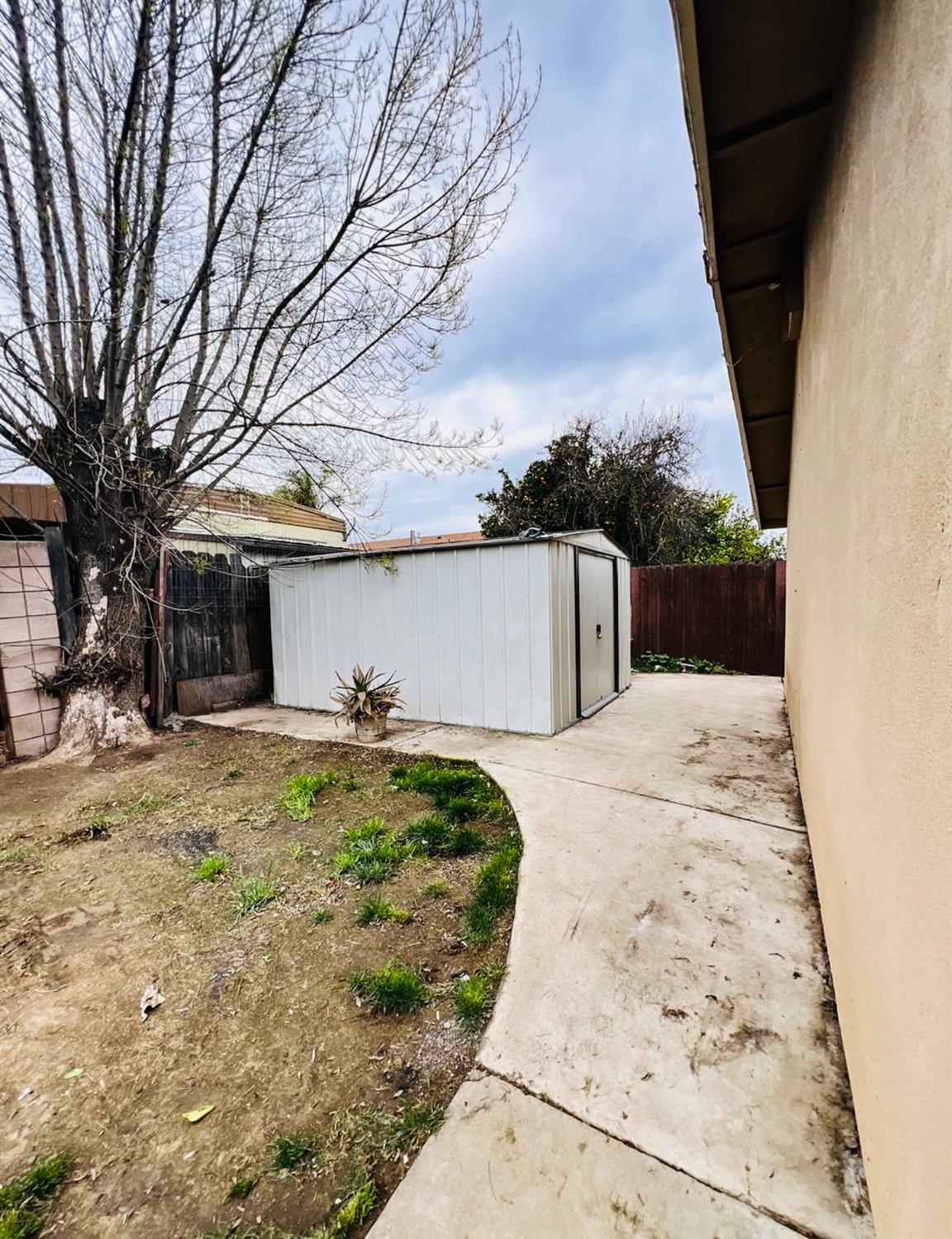 2101 Milford Lane Modesto, CA 95355 - Photo 15 of 18 front view of a house with a yard