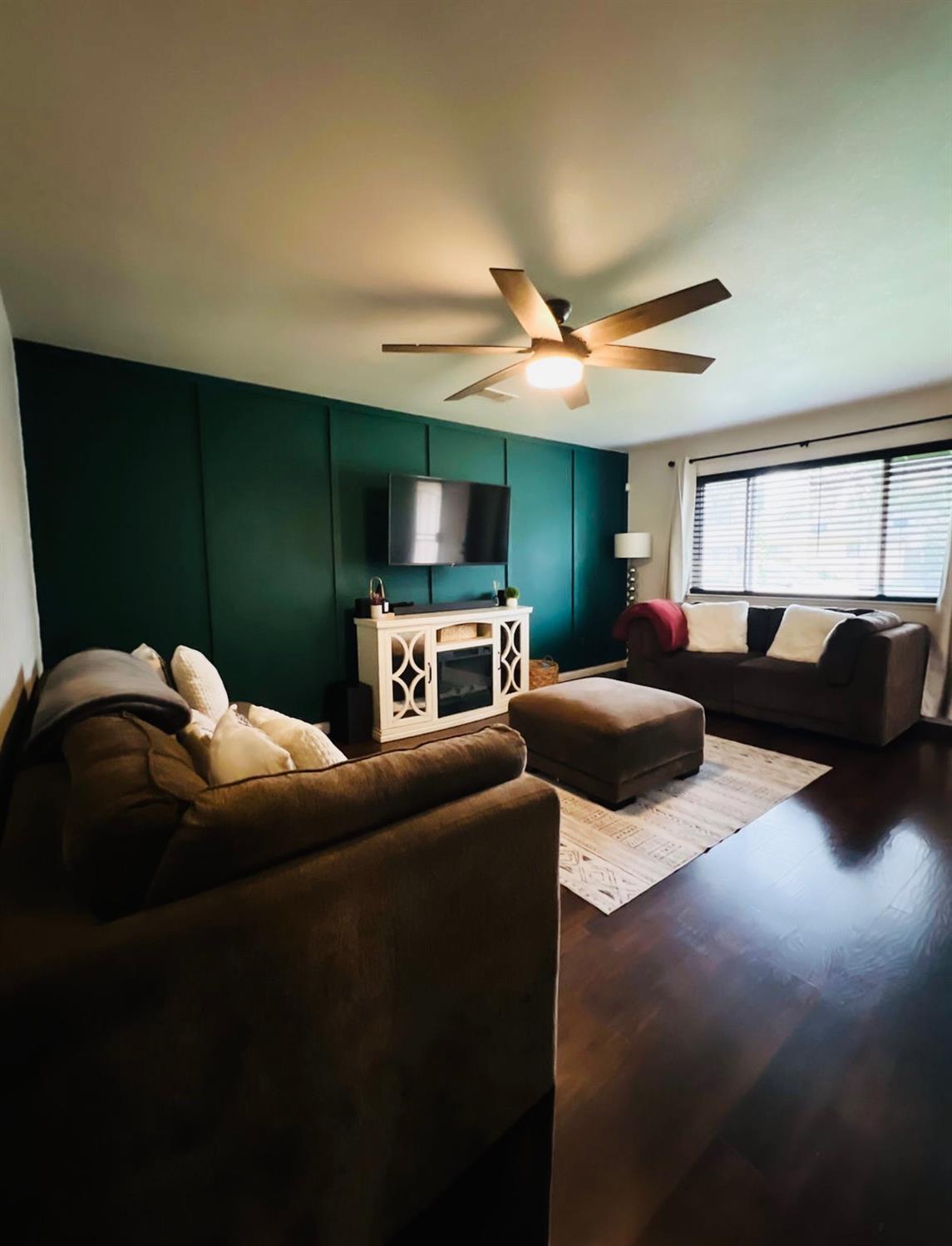 2101 Milford Lane Modesto, CA 95355 - Photo 4 of 18 a living room with furniture and a flat screen tv