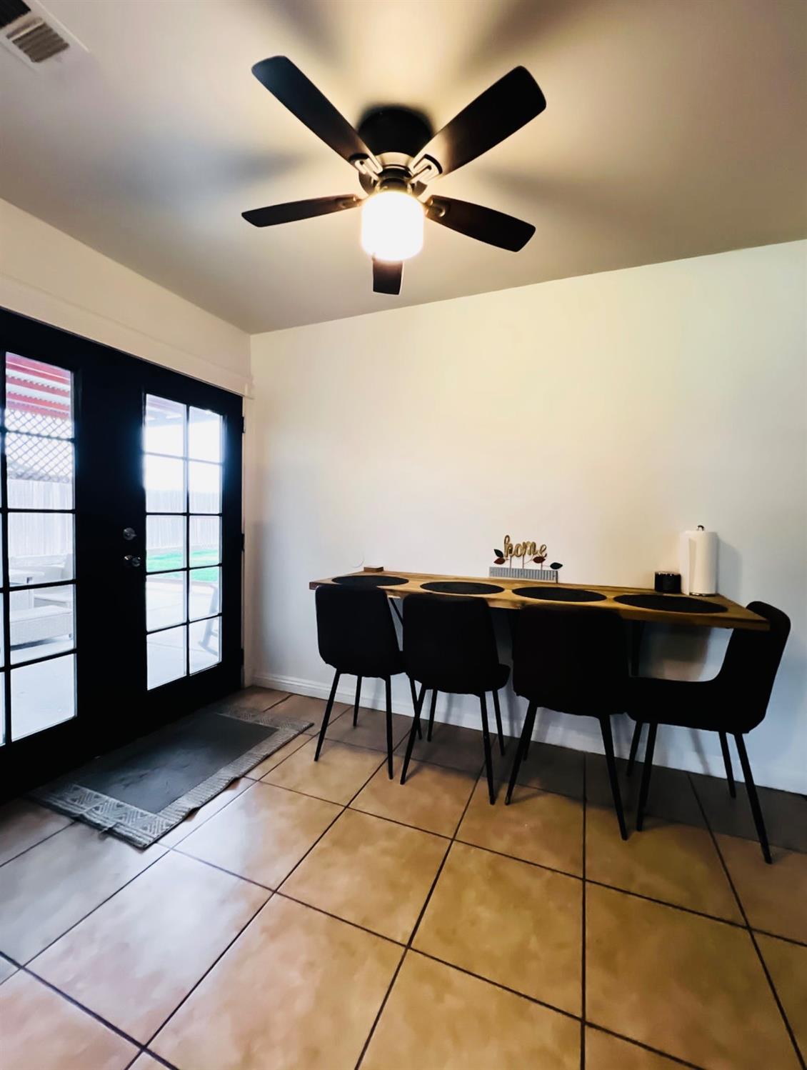 2101 Milford Lane Modesto, CA 95355 - Photo 6 of 18 a living room with furniture and a ceiling fan