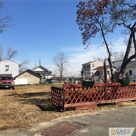 445 Harding Road Old Bridge, NJ 08879 - Photo 2 of 8 a view of a couches in front of a house