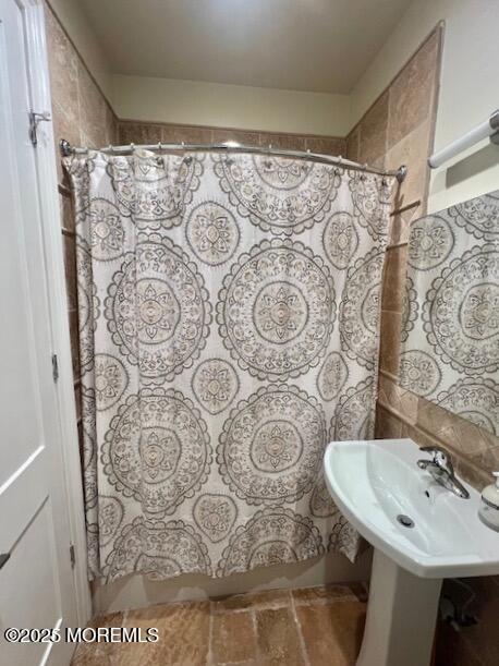 892 Elberon Avenue, Unit STUDIO Elberon, NJ 07740 - Photo 16 of 24 a bathroom with a sink and mirror with toilet