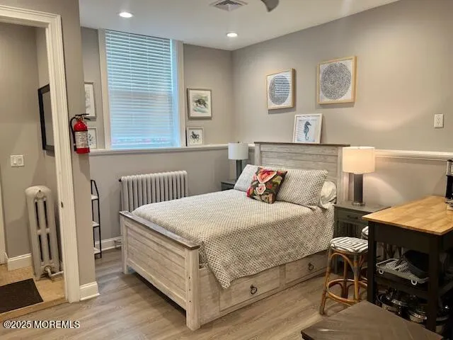 a bedroom with a bed and a table