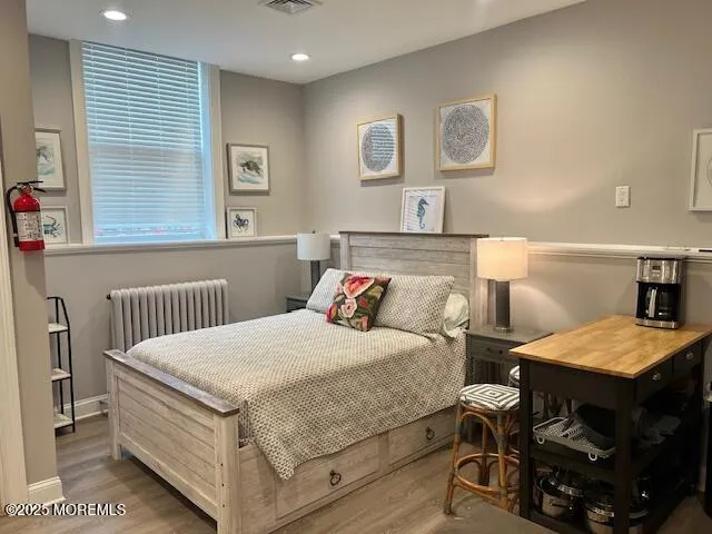 a bedroom with a bed and a table in it