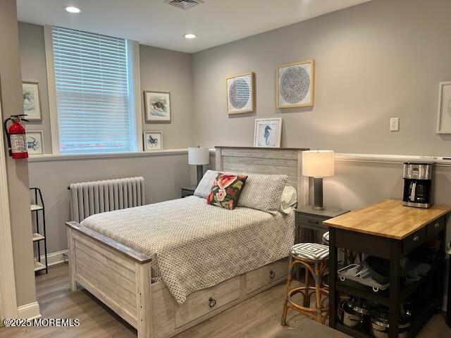 892 Elberon Avenue, Unit STUDIO Elberon, NJ 07740 - Photo 8 of 24 a bedroom with a bed and a table in it