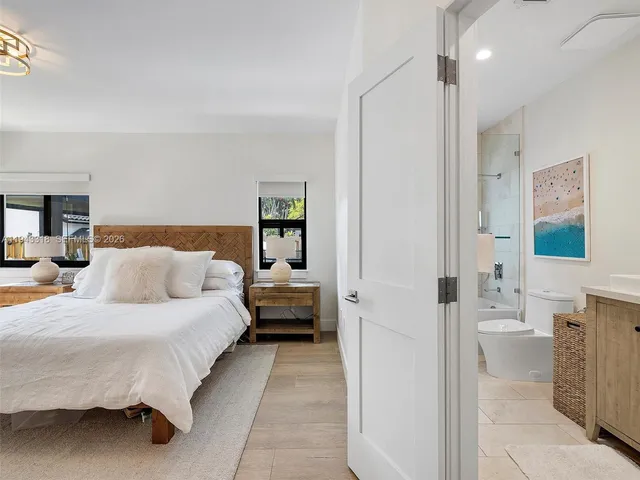 a bedroom with a bed and a couch