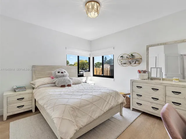 a bedroom with a bed and a closet