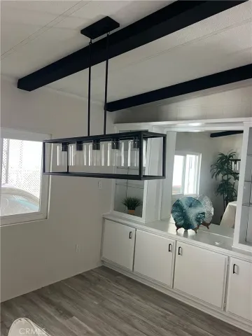 a view of a living room and hardwood floor