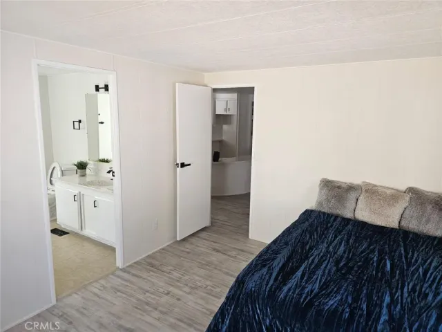 a bedroom with a bed and cabinets