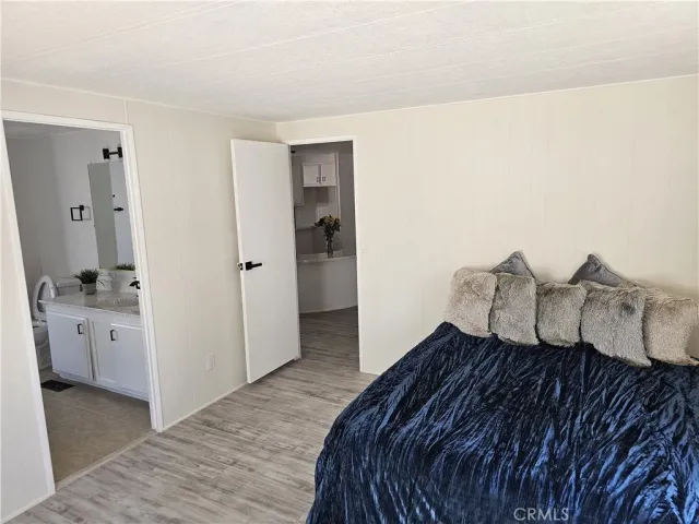 a bedroom with a bed and a stove