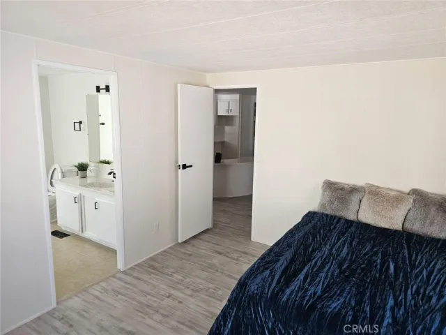 a bedroom with a bed and cabinets