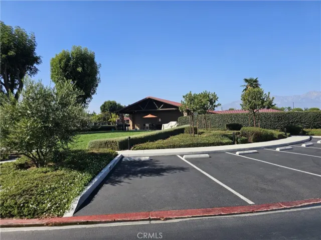 a view of a house with a yard and sitting area