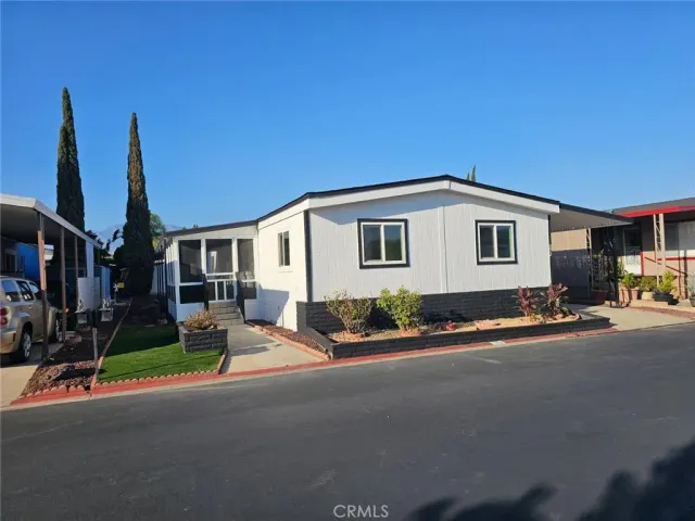 a backyard of a house with yard fire pit and outdoor seating