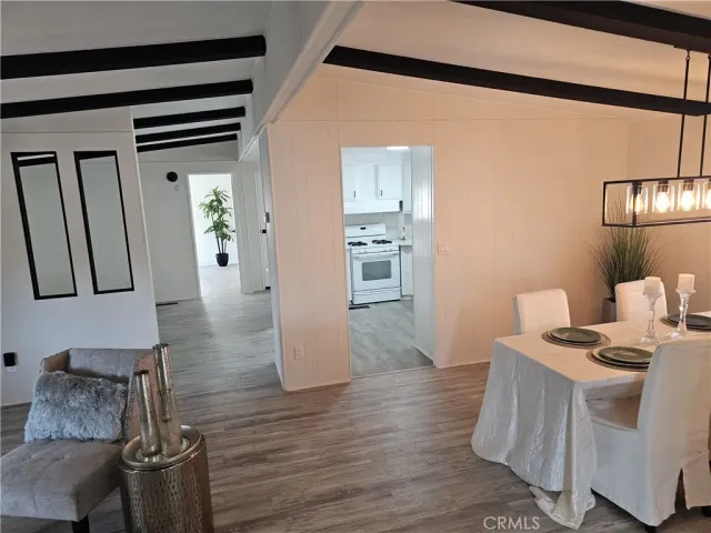 a view of kitchen with furniture and wooden floor