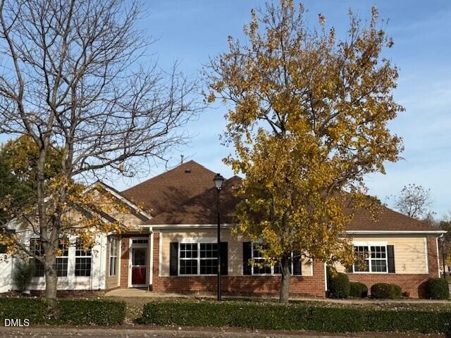 front view of a house with a garden