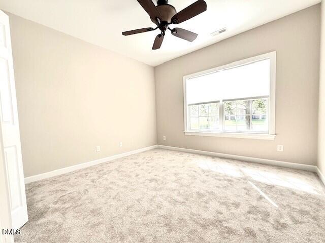 4713 Ivy Crest Court Raleigh, NC 27604 - Photo 15 of 46 an empty room with windows and ceiling fan