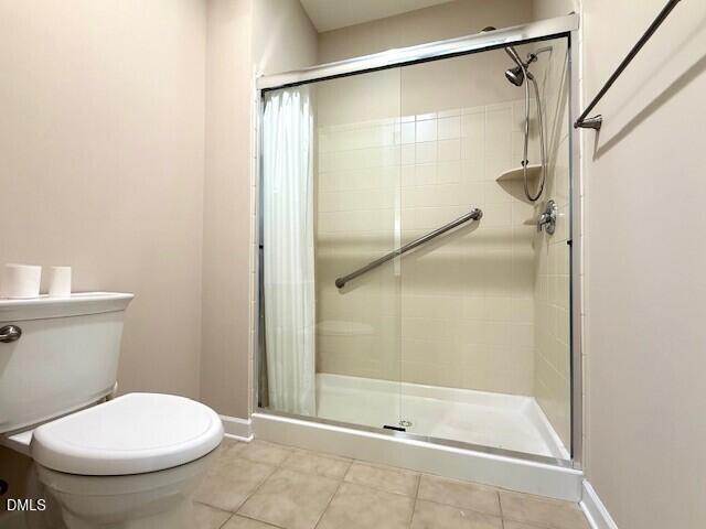 4713 Ivy Crest Court Raleigh, NC 27604 - Photo 22 of 46 a bathroom with a toilet and a shower