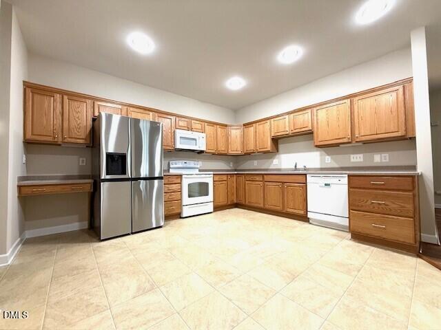 4713 Ivy Crest Court Raleigh, NC 27604 - Photo 28 of 46 a kitchen with stainless steel appliances granite countertop a refrigerator and a stove top oven
