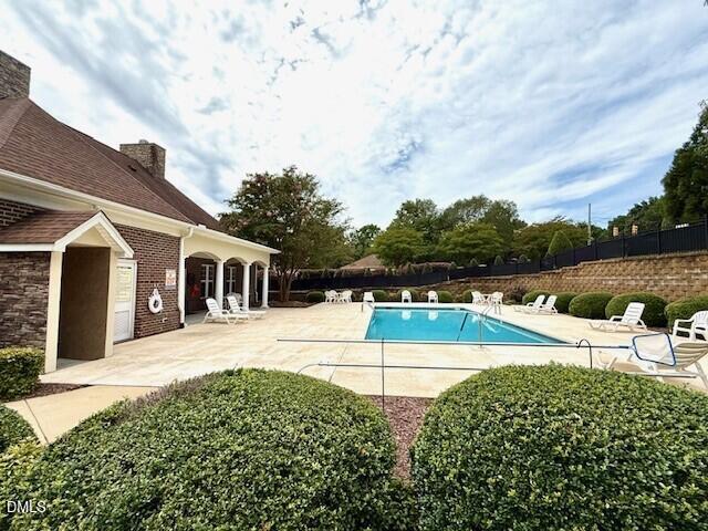 4713 Ivy Crest Court Raleigh, NC 27604 - Photo 42 of 46 a view of a house with pool and a yard