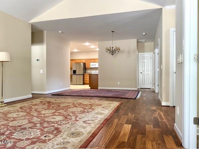 4713 Ivy Crest Court Raleigh, NC 27604 - Photo 9 of 46 a view of a livingroom with wooden floor and kitchen space