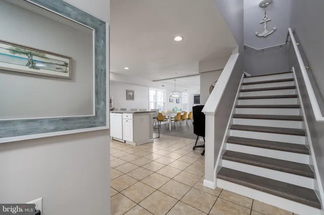 a view of a kitchen with wooden floor and electronic appliances